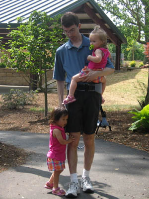 On a little walk, holding on to Dad